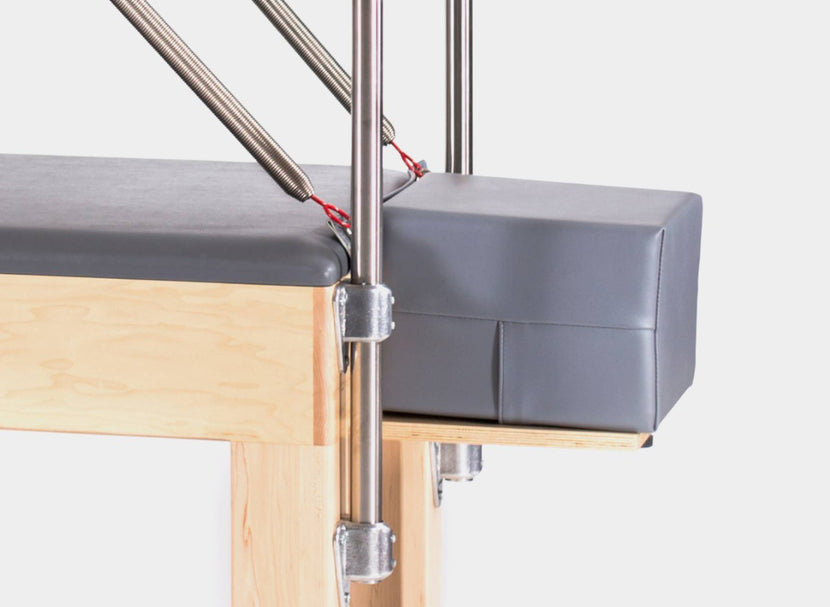 Trap table extender component for Pilates.
